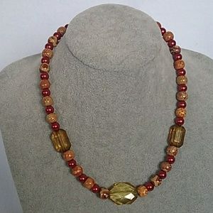 Safari beads and red beaded necklace